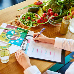Customized Nutrition Planning - doctor writes out plan for patient
